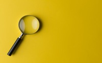 
Magnifying glass on a yellow background